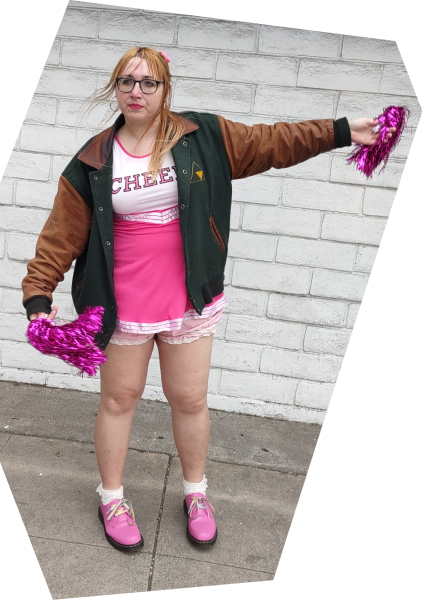 Gorgeous picture of a stacked babe in a cheerleader costume who's incredibly talented at making websites.